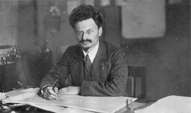 Leon_Trotsky_at_his_desk_Image_public_domain.jpg